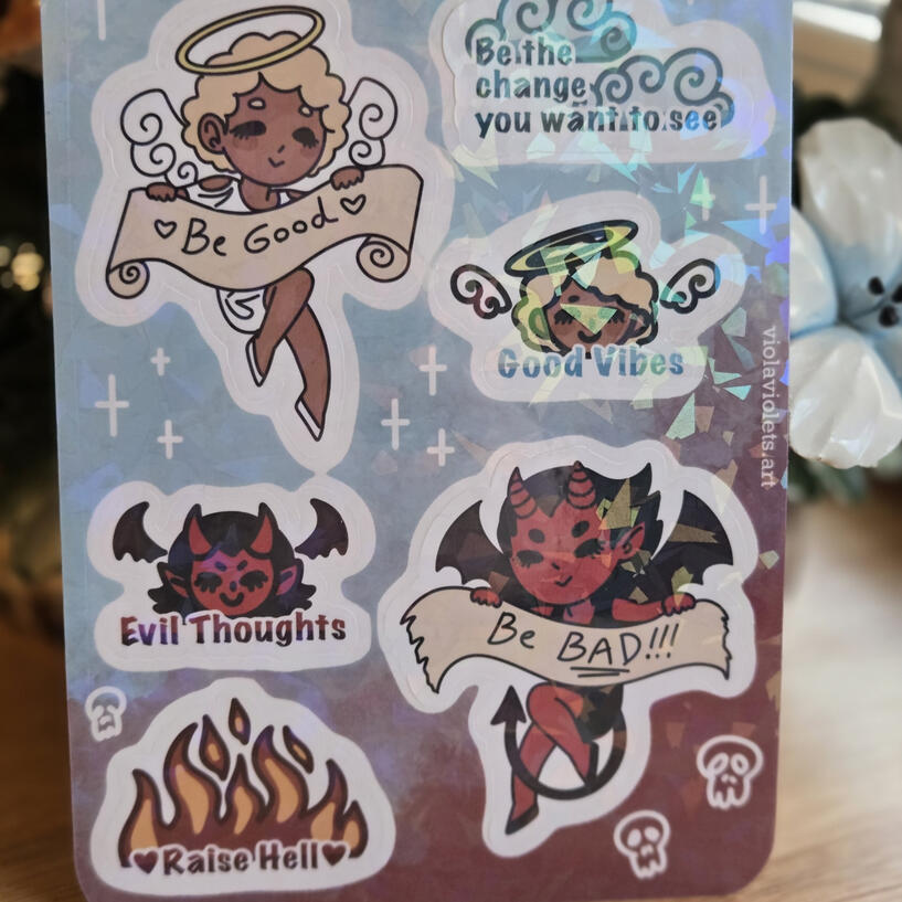 A sticker sheet featuring an angel, a devil, and funny sayings for each.